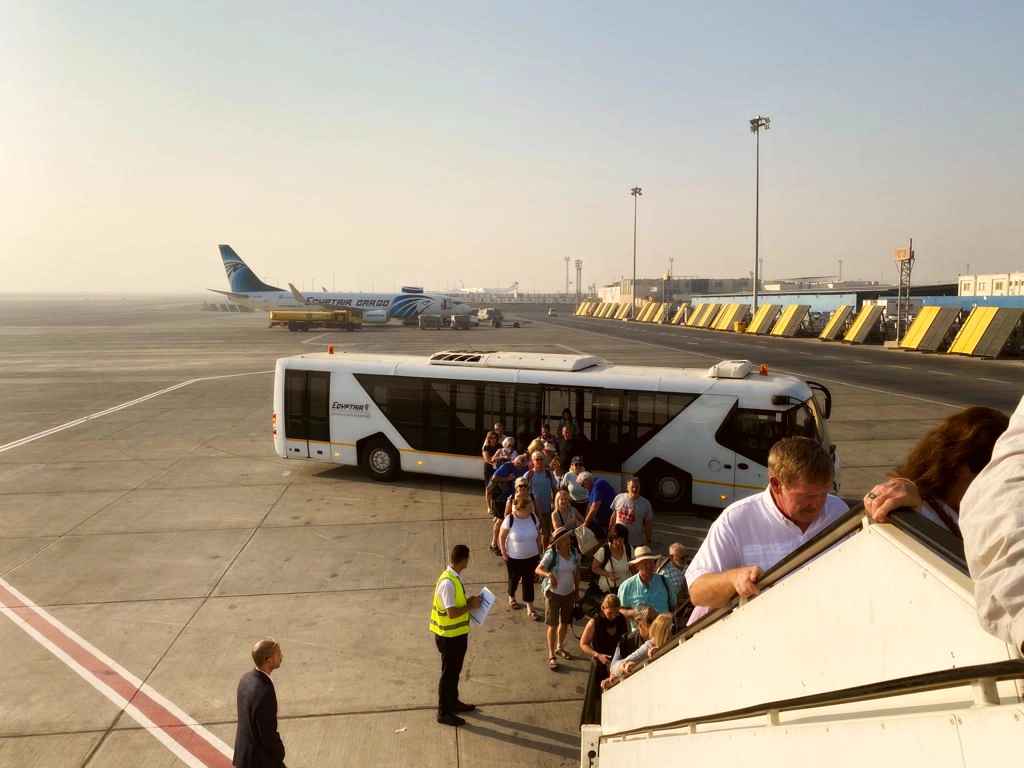 Group boarding a charter FlyEgypt Airlines.